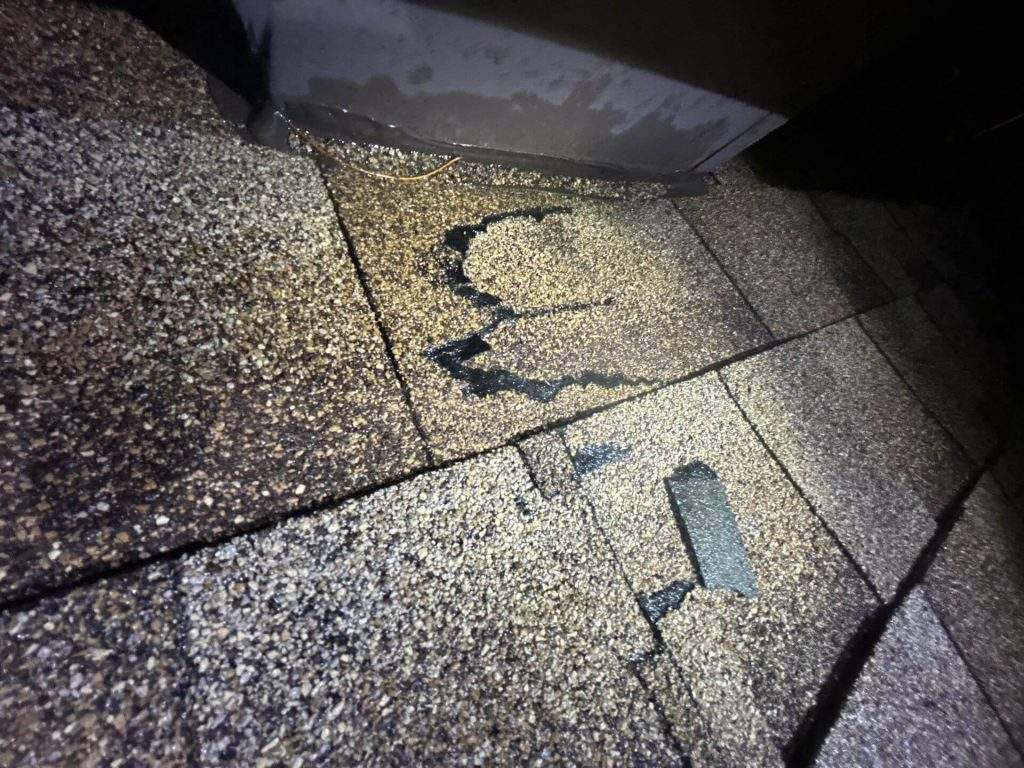 professional performing a roof inspection in kingston