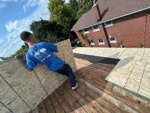 vanity worker installing roof in kingston