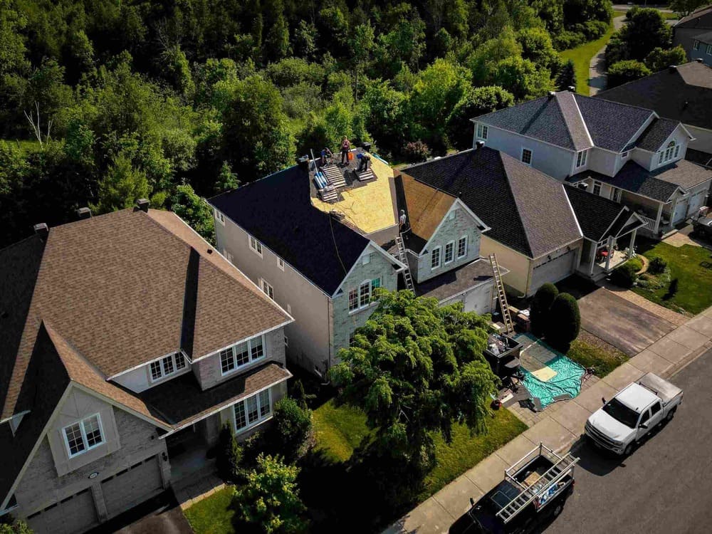 Vanity Roofing contractors performing a residential roof replacement in kingston